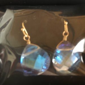 Shimmering teardrop blue earrings . Gold metal. New in box